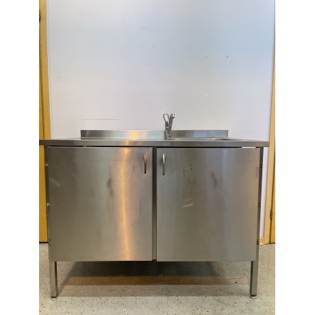 Stainless steel table with 2 doors and sink on the right